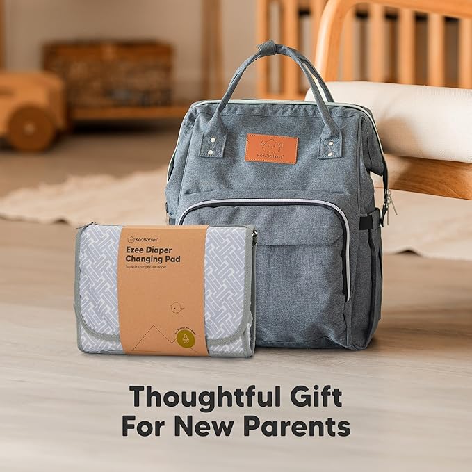 KeaBabies Portable Diaper Changing Pad - Large Waterproof Baby Changing Mat, Compact Travel Diaper Clutch, Functional Pockets Fit Newborn Essentials, Wipeable & Padded Baby Changer (Prism)